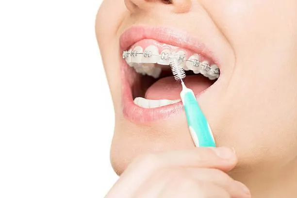 a close-up of a person brushing her teeth