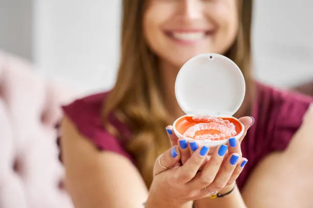 Close-up of Invisalign box in the hands of a woman